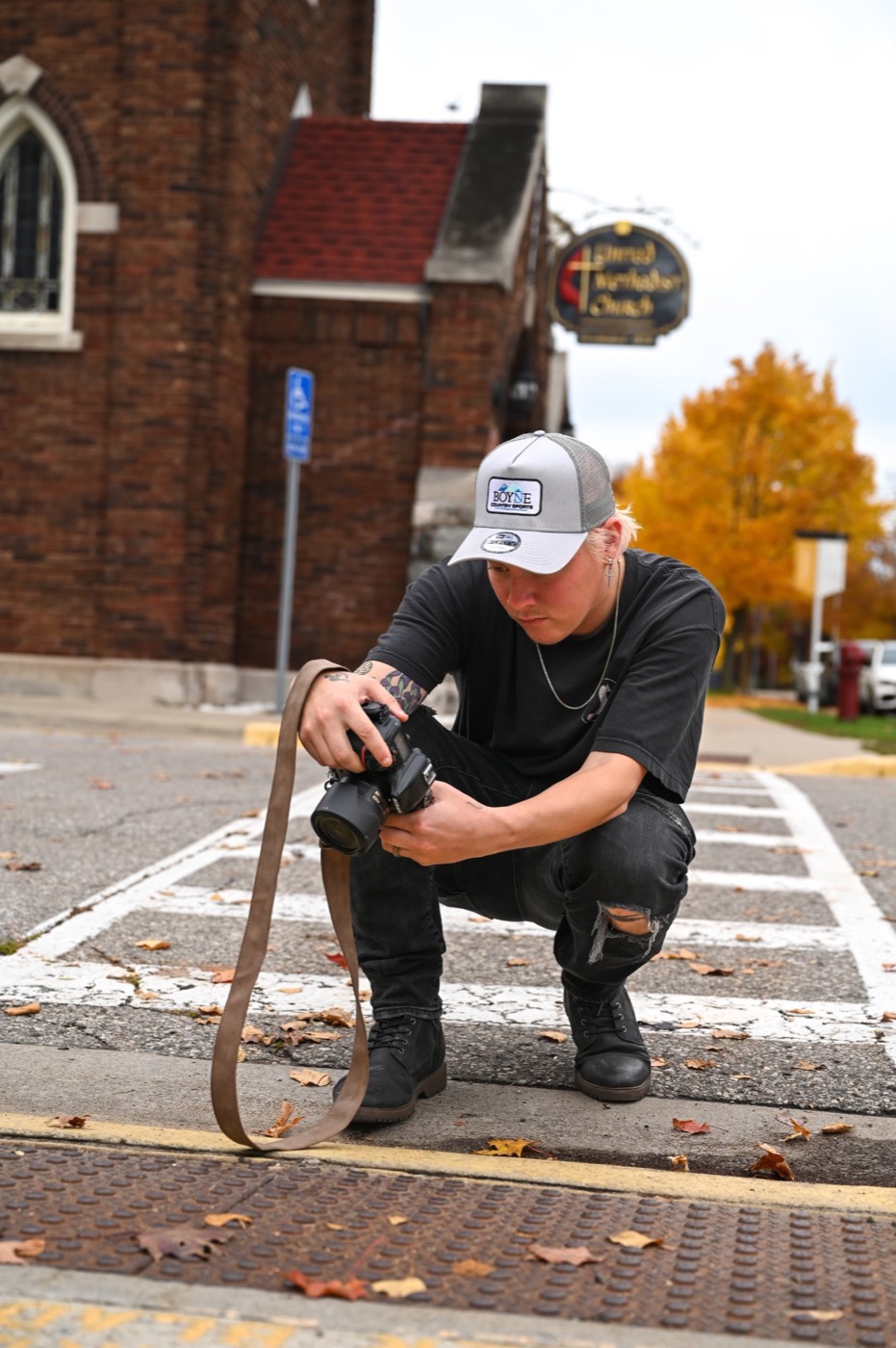 Dameon Spencer photographing a street scene in downtown Mount Pleasant, Michigan