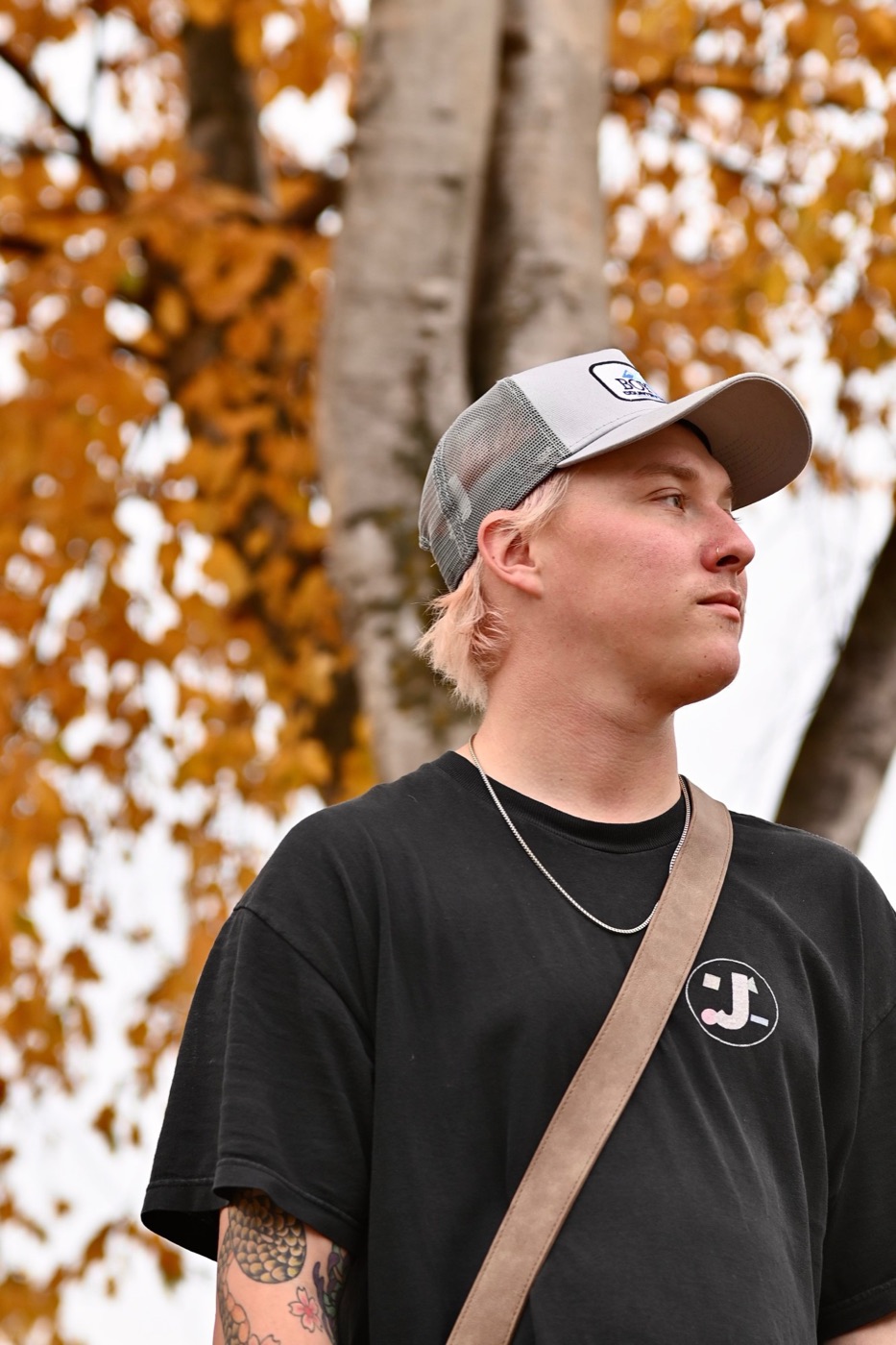 Dameon Spencer portrait under fall leaves